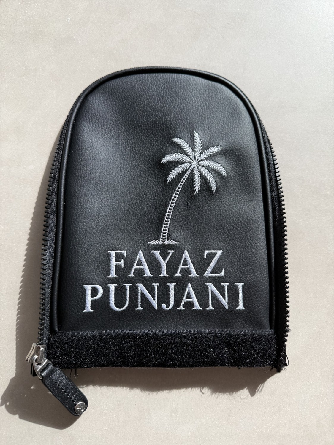Black pouch with a palm tree and personalised name embroidery